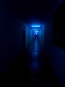 photo of empty dimly lit hallway